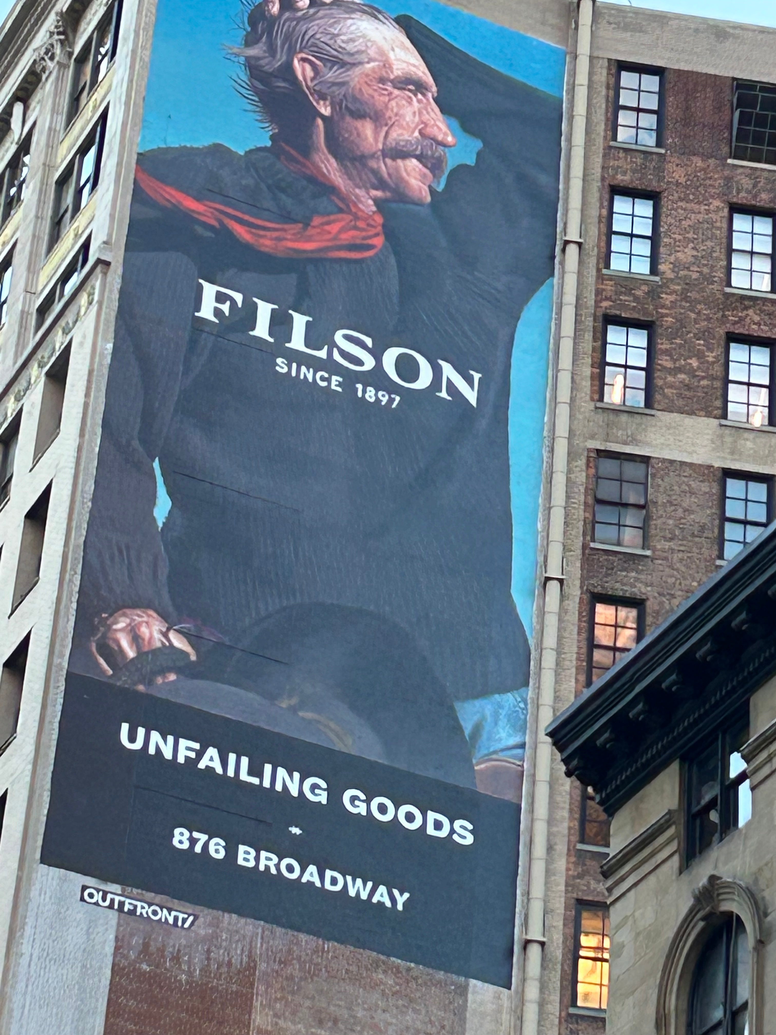 WeatherWool is very interested to see, in November of 2025, a Filson billboard across the street from a Carhartt retail store on Broadway at 22nd Street in Midtown Manhattan, New York City. Photo credits THANKS JR MORRISSEY/Factory8